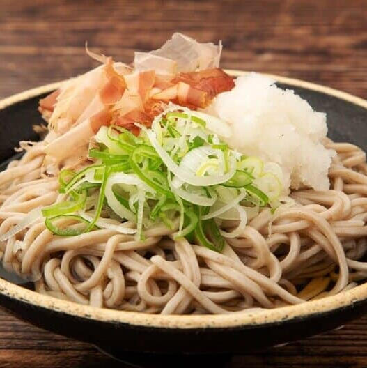 Popoto Soba Buckwheat noodles steeped in savory broth and topped with a starchy paste created by grinding a raw mountain popoto.