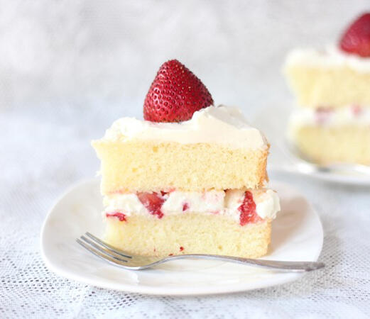 Hingan Strawberry Shortcake A rich white cake, filled with a cream and berry frosting and topped with rolanberries.