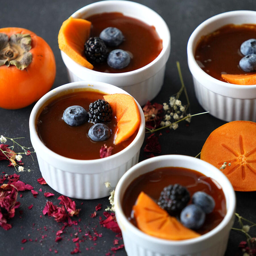 Persimmon Pudding A rich steamed dessert made with puréed persimmons and eggs. Topped with sugar and caramelized until lightly crunchy.